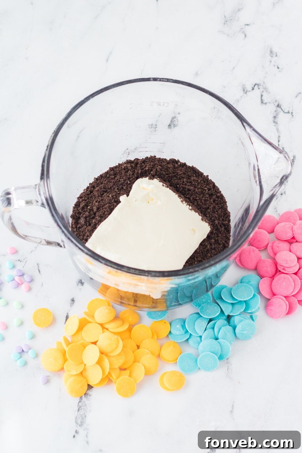 Festive Easter Egg Oreo Truffles 6 Finely crushed Oreos and a block of softened cream cheese ready to be mixed for the Easter Egg Oreo Truffles base.