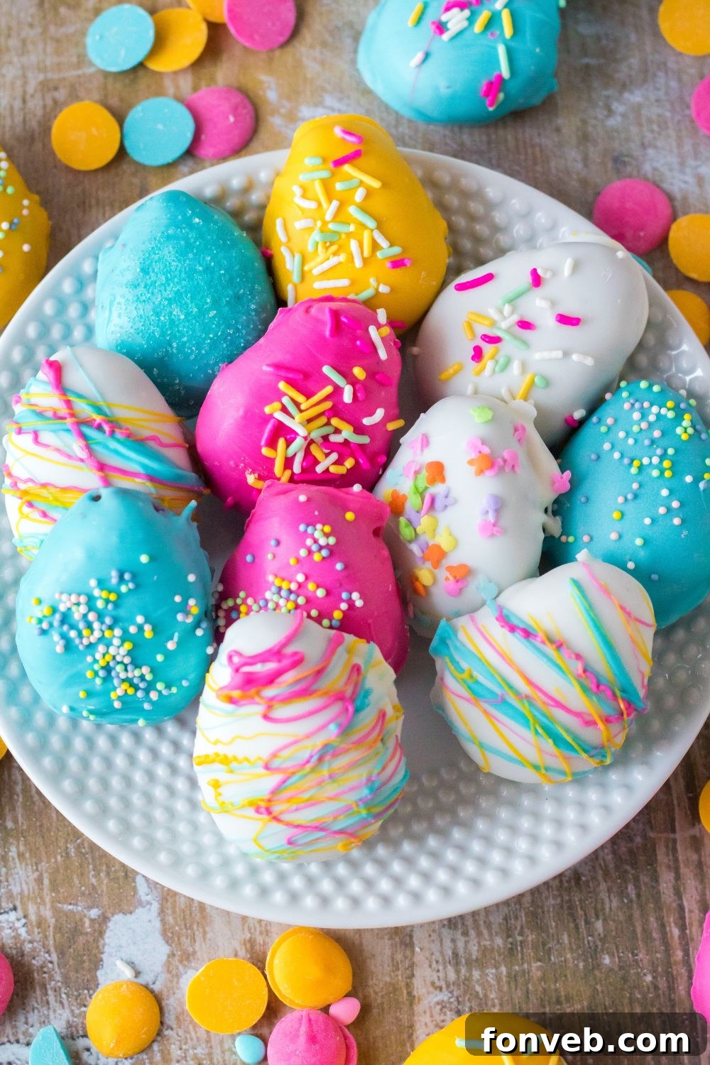 Festive Easter Egg Oreo Truffles 9 A generous spread of finished Easter Egg Oreo Truffles, vibrantly decorated with sprinkles and colorful coatings, presented beautifully on a large plate on a table.