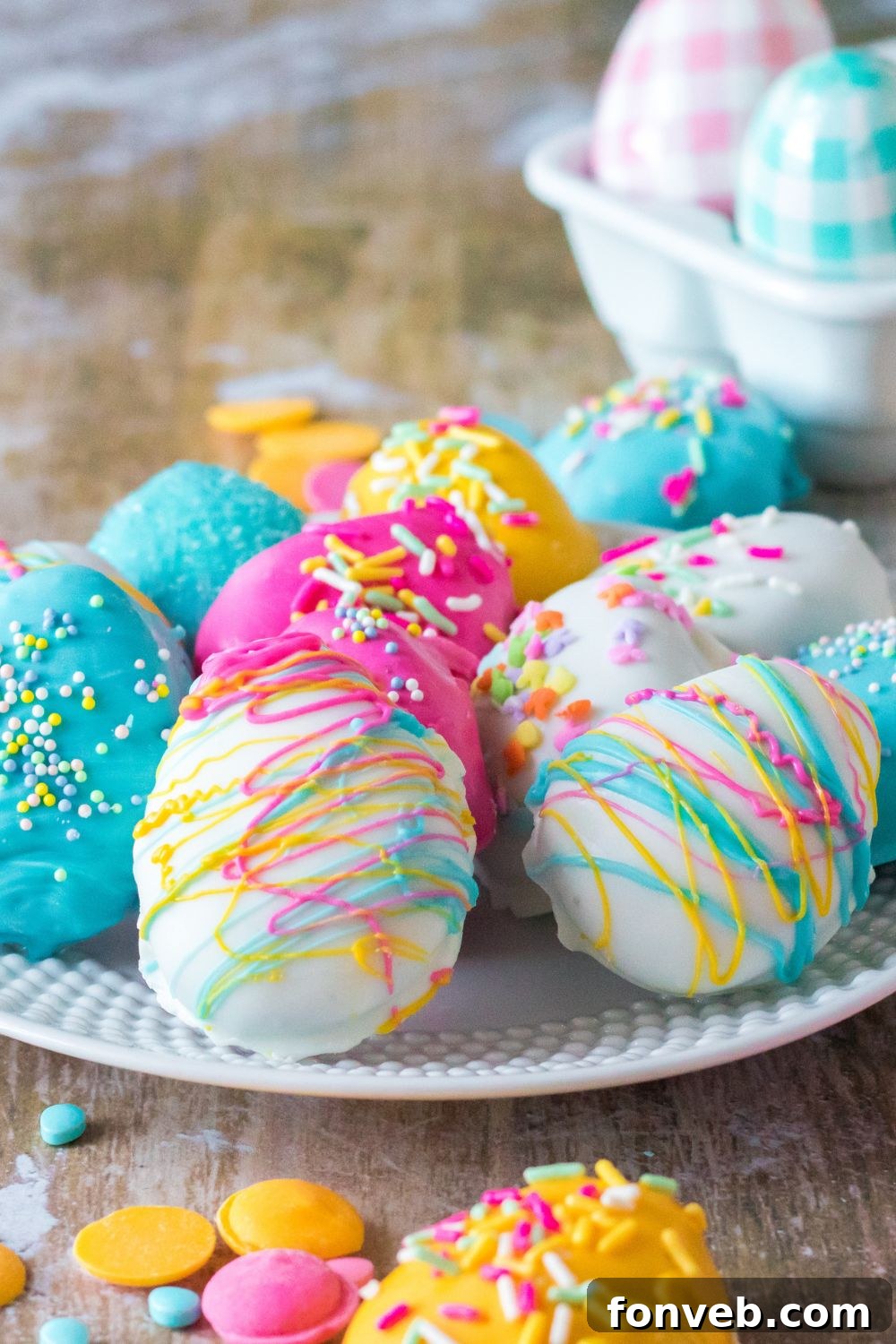 Festive Easter Egg Oreo Truffles 10 A close-up view of beautifully decorated Easter Egg Oreo Truffles artfully arranged on a plate, highlighting the intricate details of the sprinkles and the smooth, colorful chocolate coatings.