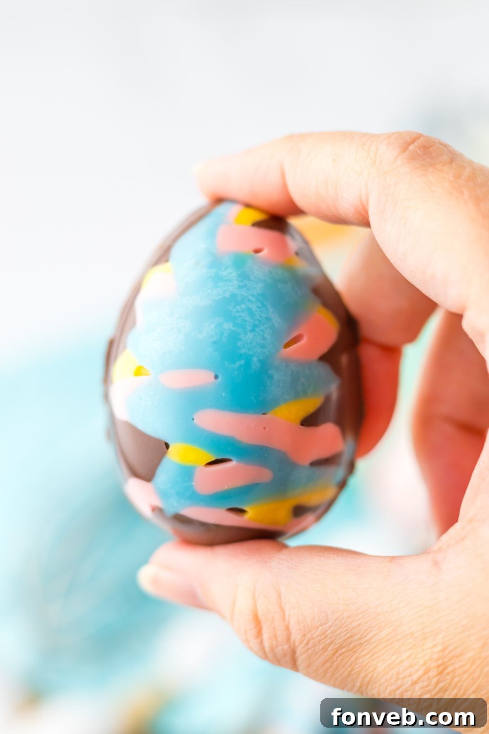 Fluffy Easter Delights 13 Easter Marshmallow Egg being held in a hand above the table
