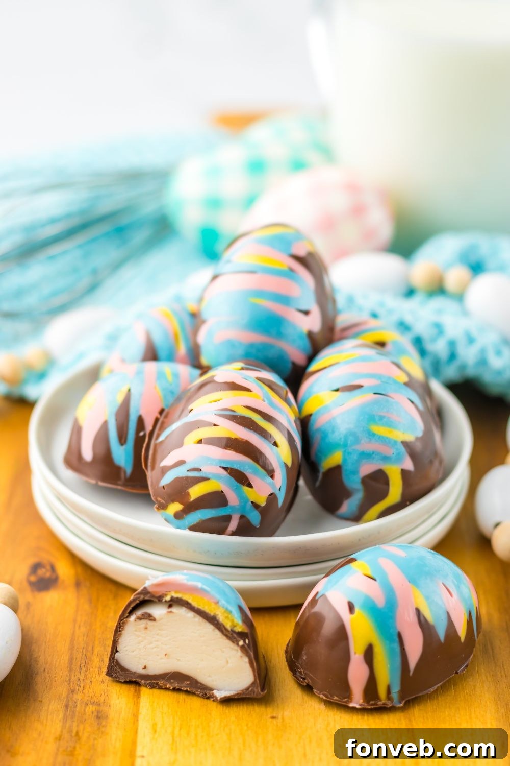 Fluffy Easter Delights 14 Easter Marshmallow Eggs that ar chocolate and pastel colored chocolates sitting on table in a bowl