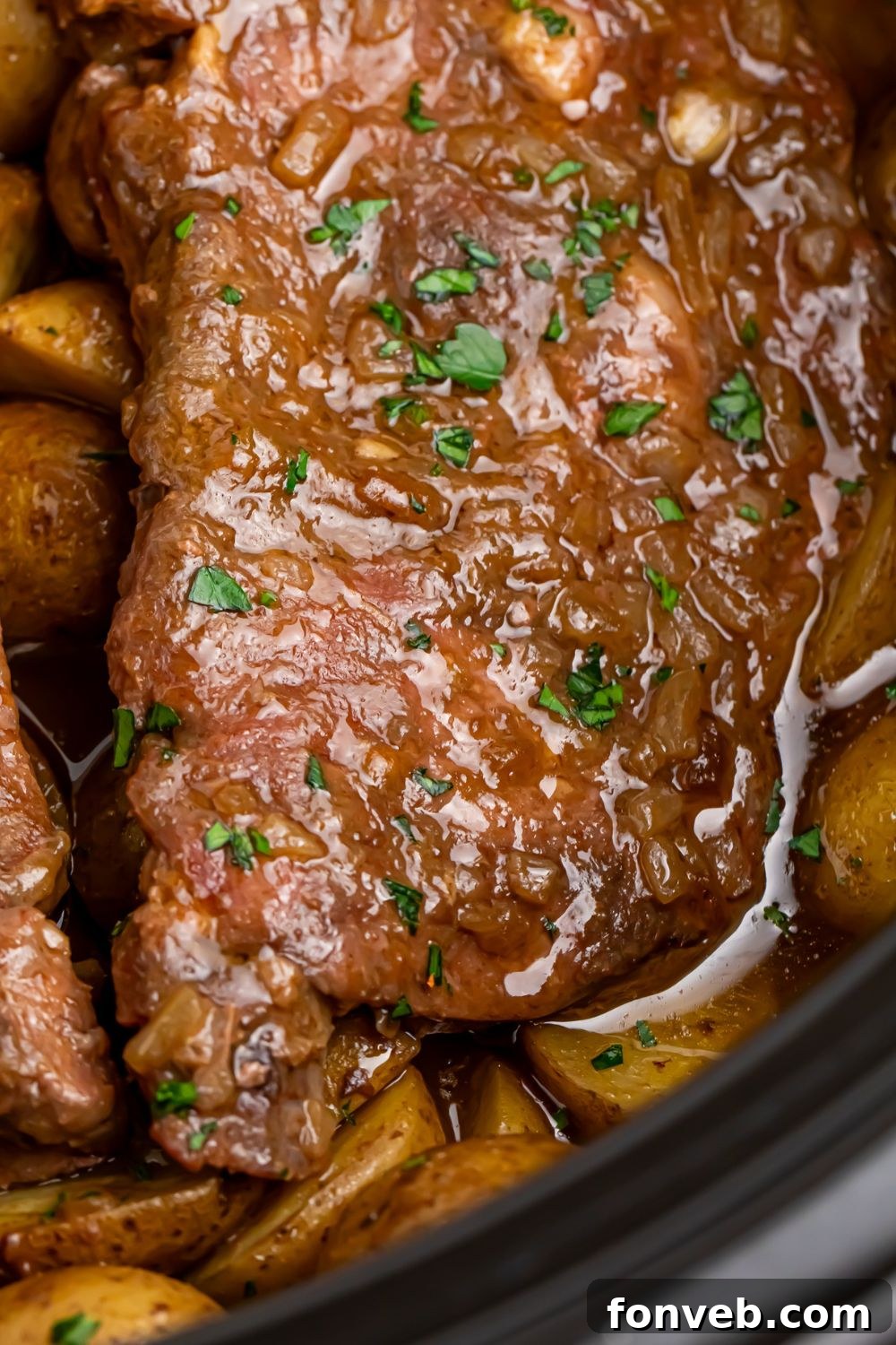 Crock Pot Steak and Potatoes simmering gently in a slow cooker