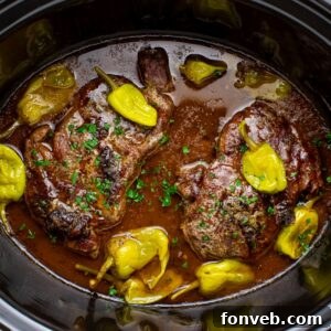 Slow Cooker Mississippi Ribeye Steaks in a slow cooker on table