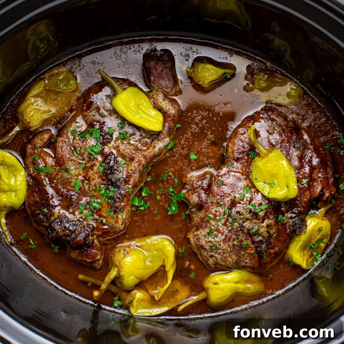 Slow Cooker Mississippi Ribeye Steaks in a slow cooker on table