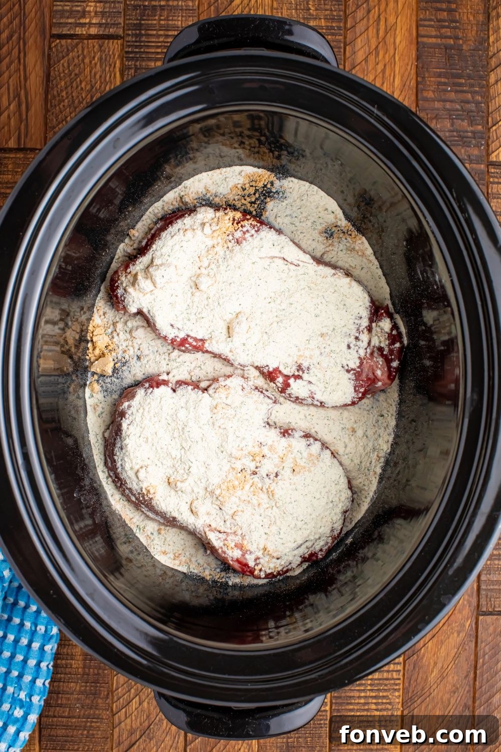 Slow Cooker Mississippi Ribeye Steaks with ranch and au jus powder over seaks