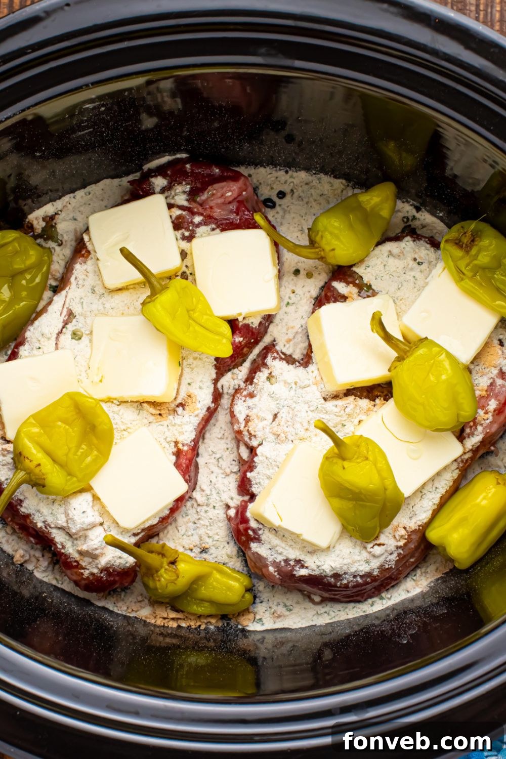 peppers and buter over Slow Cooker Mississippi Ribeye Steaks