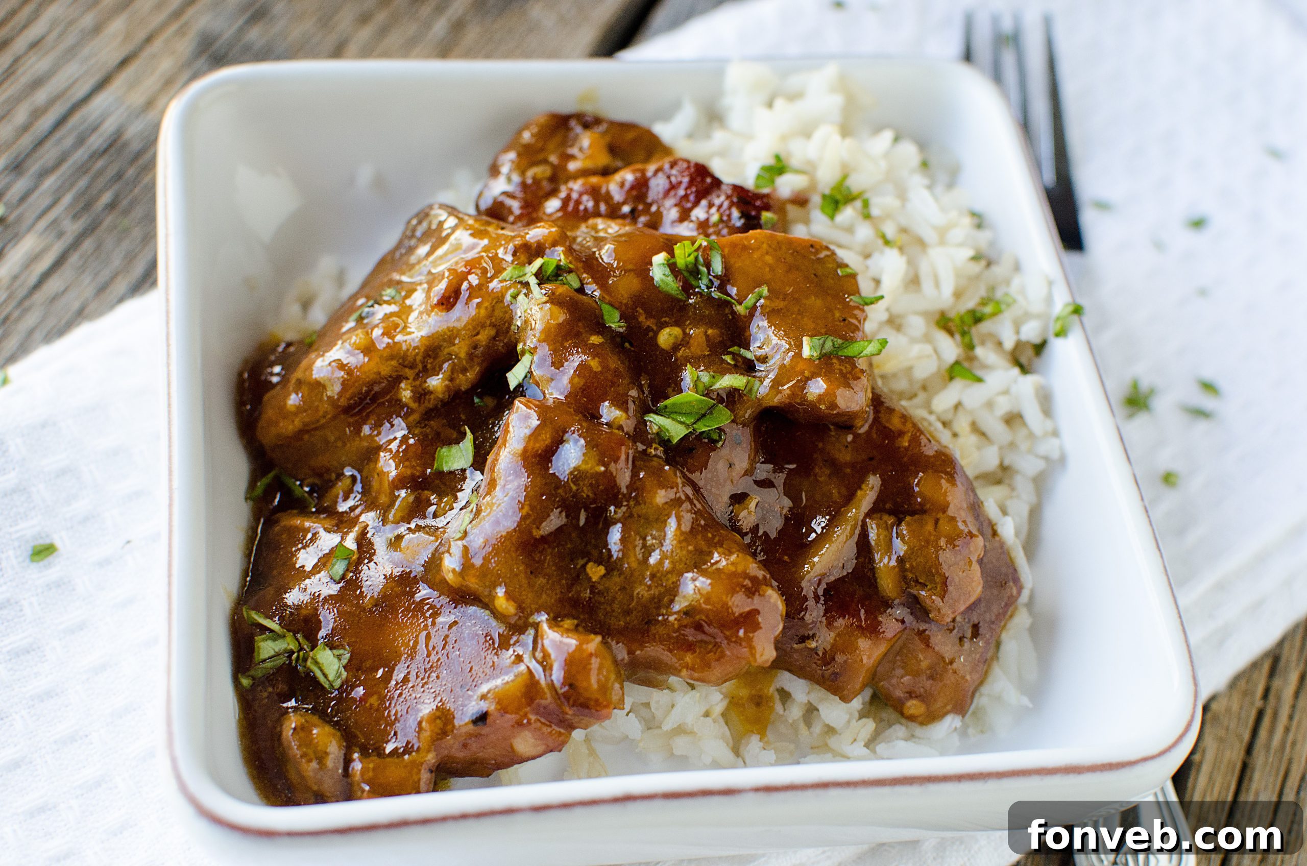 Tender Garlic Ginger Slow Cooker Pork 7 Another view of the delicious slow-cooked pork, glazed and ready to serve.