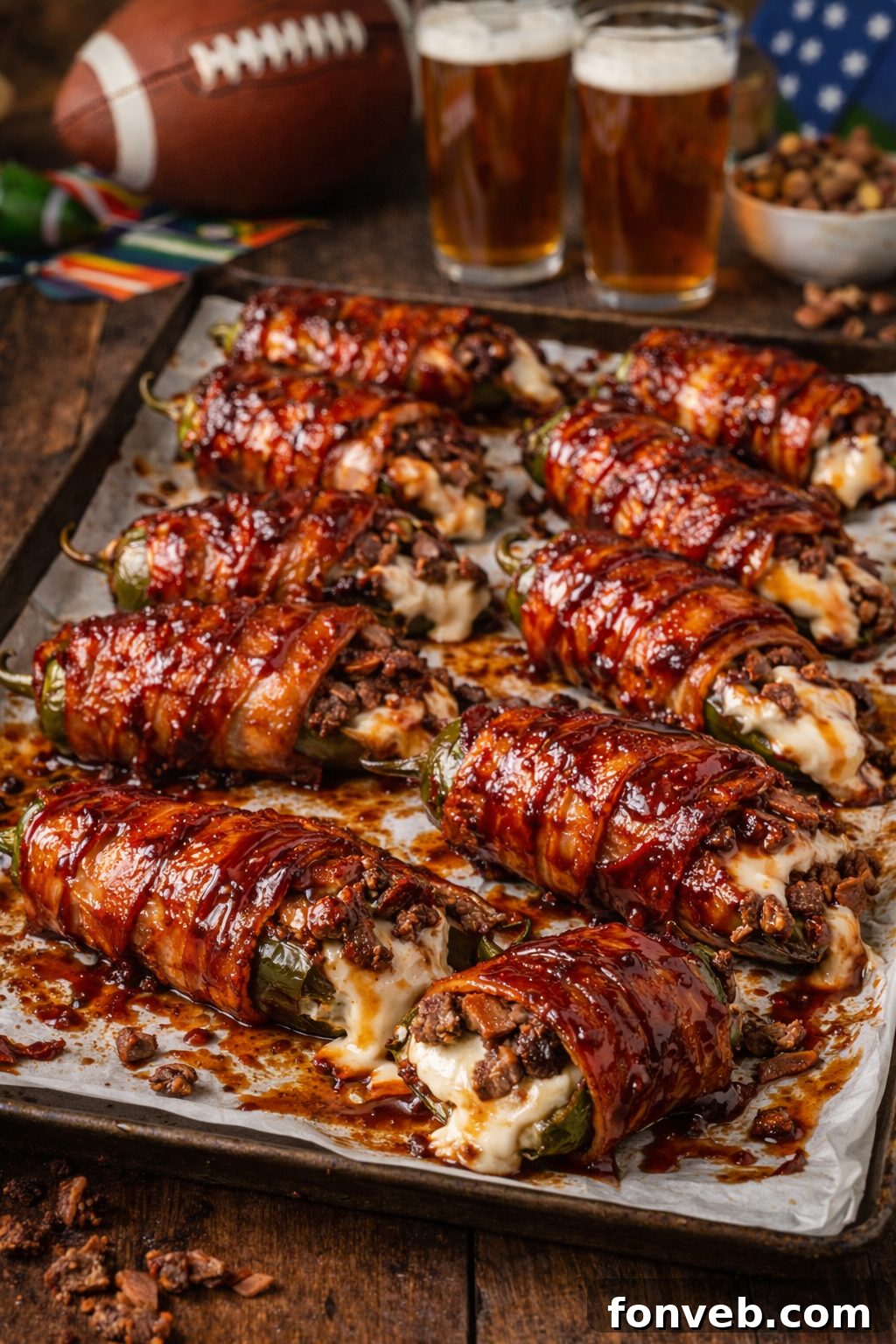 Texas Twinkies on a baking sheet with beer in the background