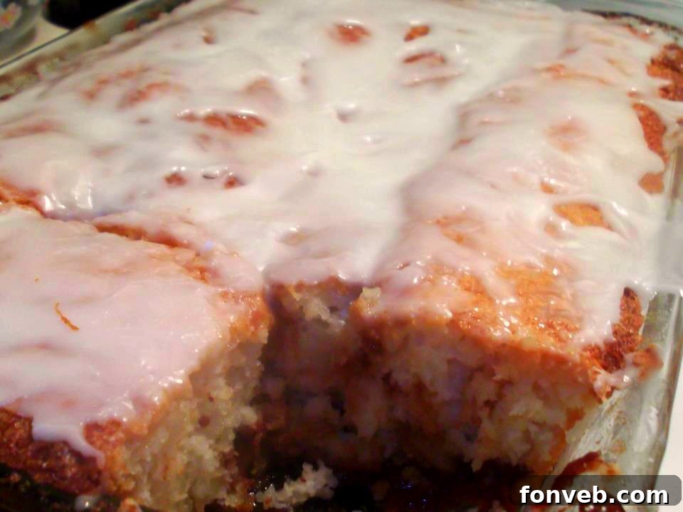 Irresistible Cinnamon Roll Cake 6 Individual slices of the decadent cinnamon roll cake on a serving plate, each piece showcasing the delightful cinnamon swirl and sweet glaze.