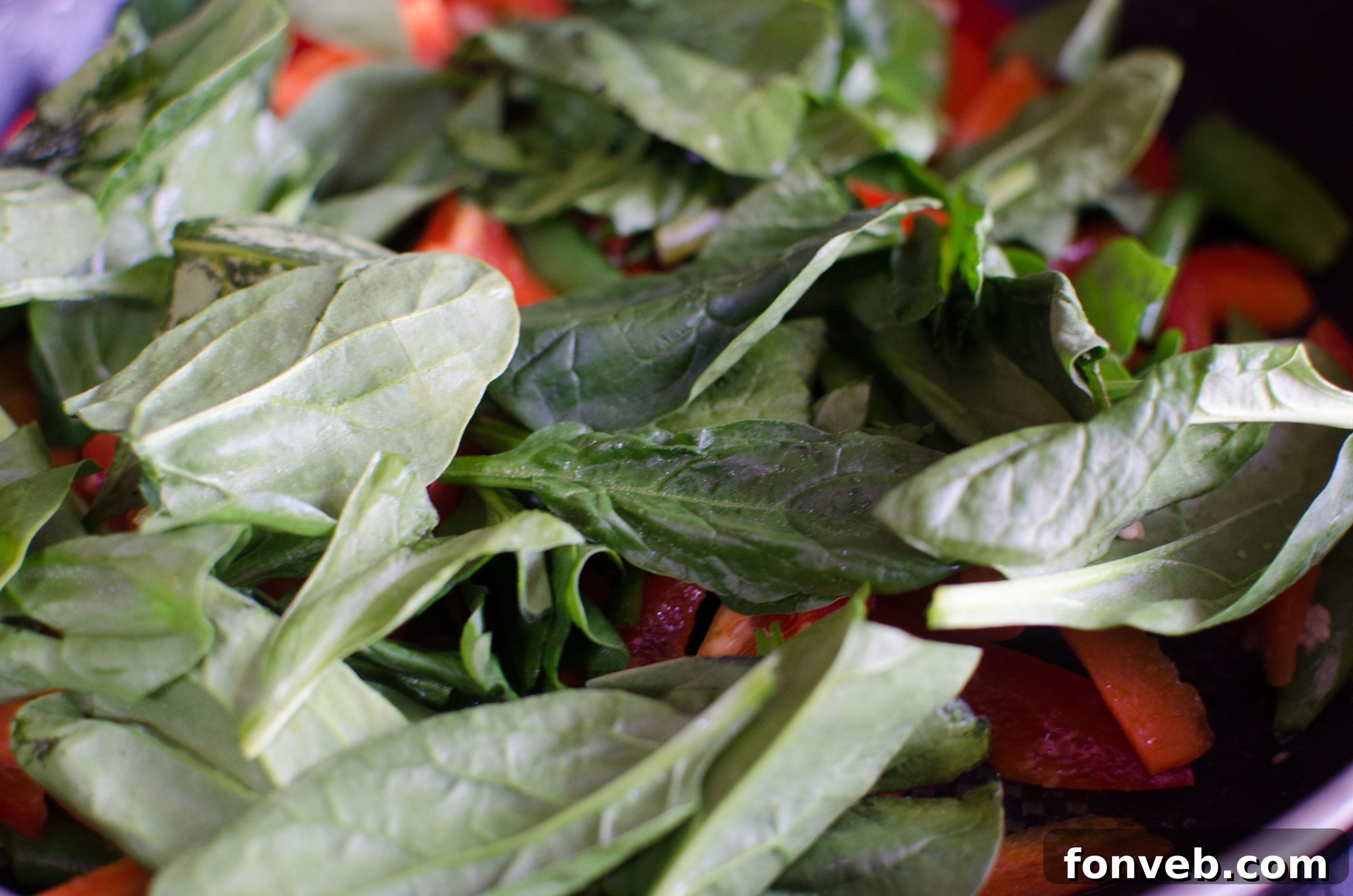 Homemade Chicken Lo Mein Better Than Takeout 4 Fresh spinach being added to the lo mein ingredients