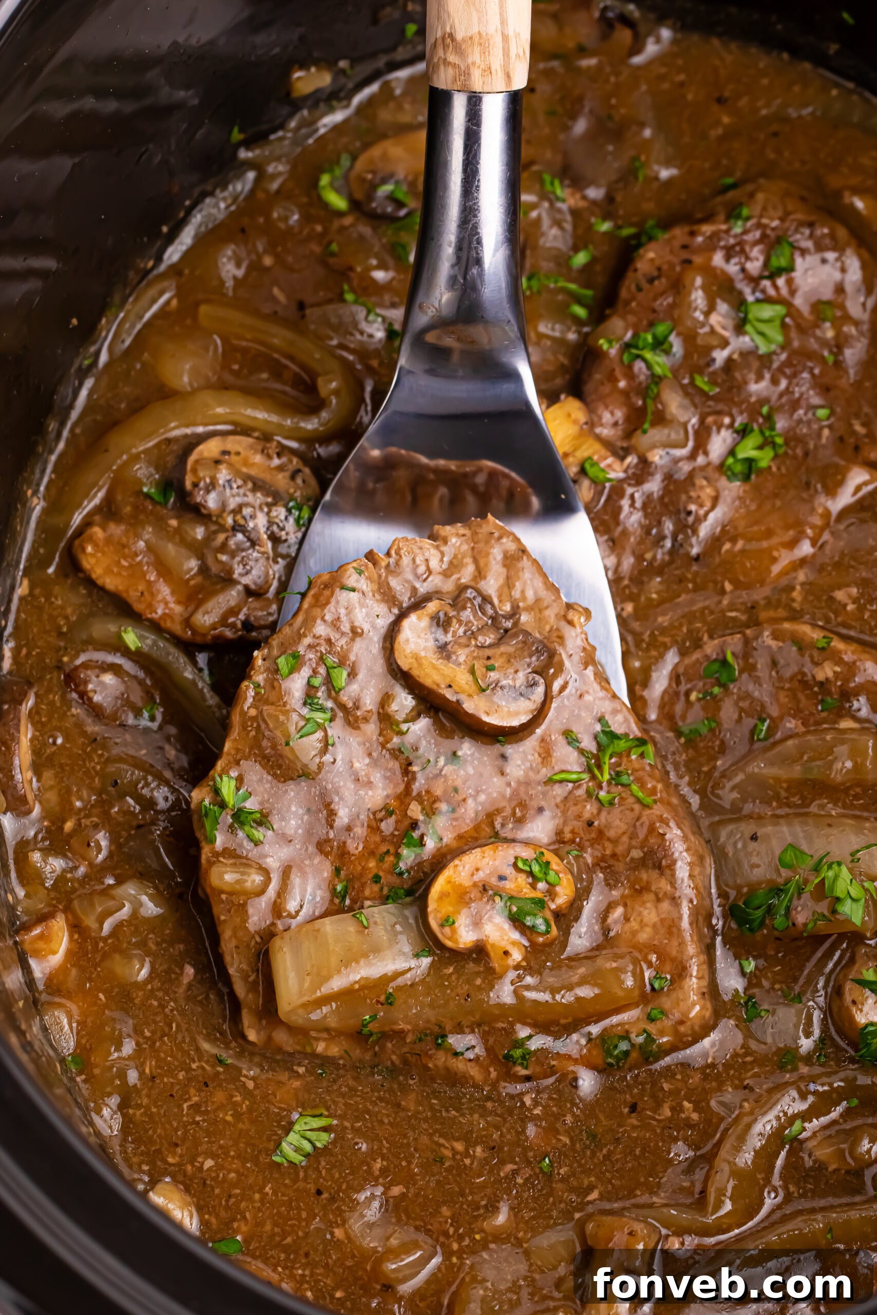 Slow Cooker Round Steak and Gravy plated with sides