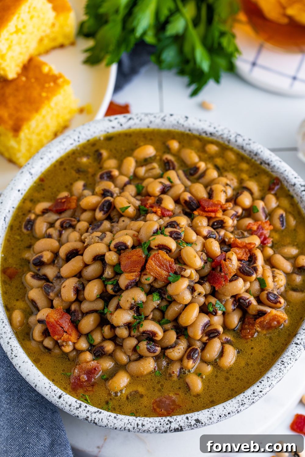 overhead look of a bowl full of bacon and black eyed peas 