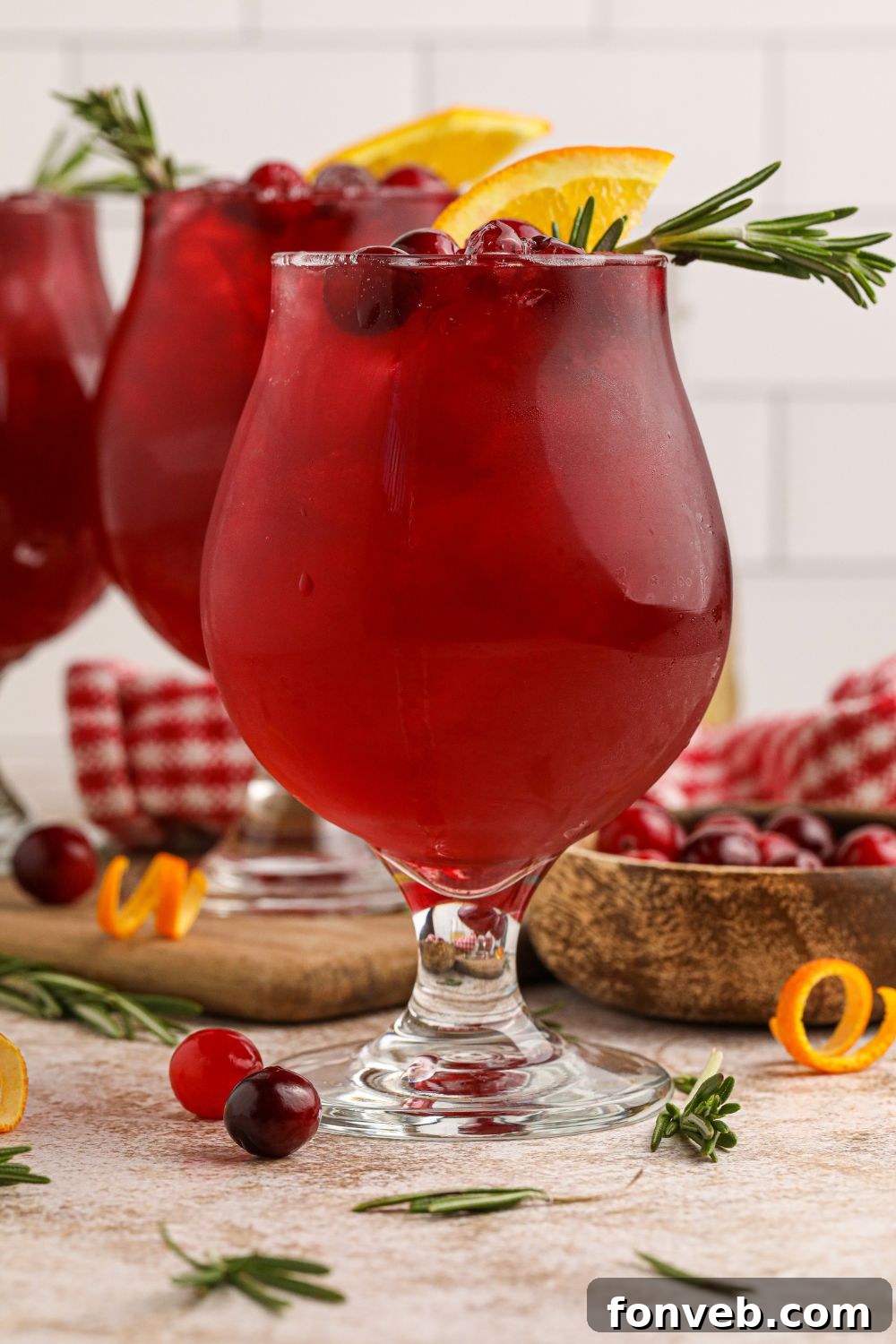 Crimson Whiskey Zing 6 cranberry ginger whiskey sour cocktails on table in glasses on table