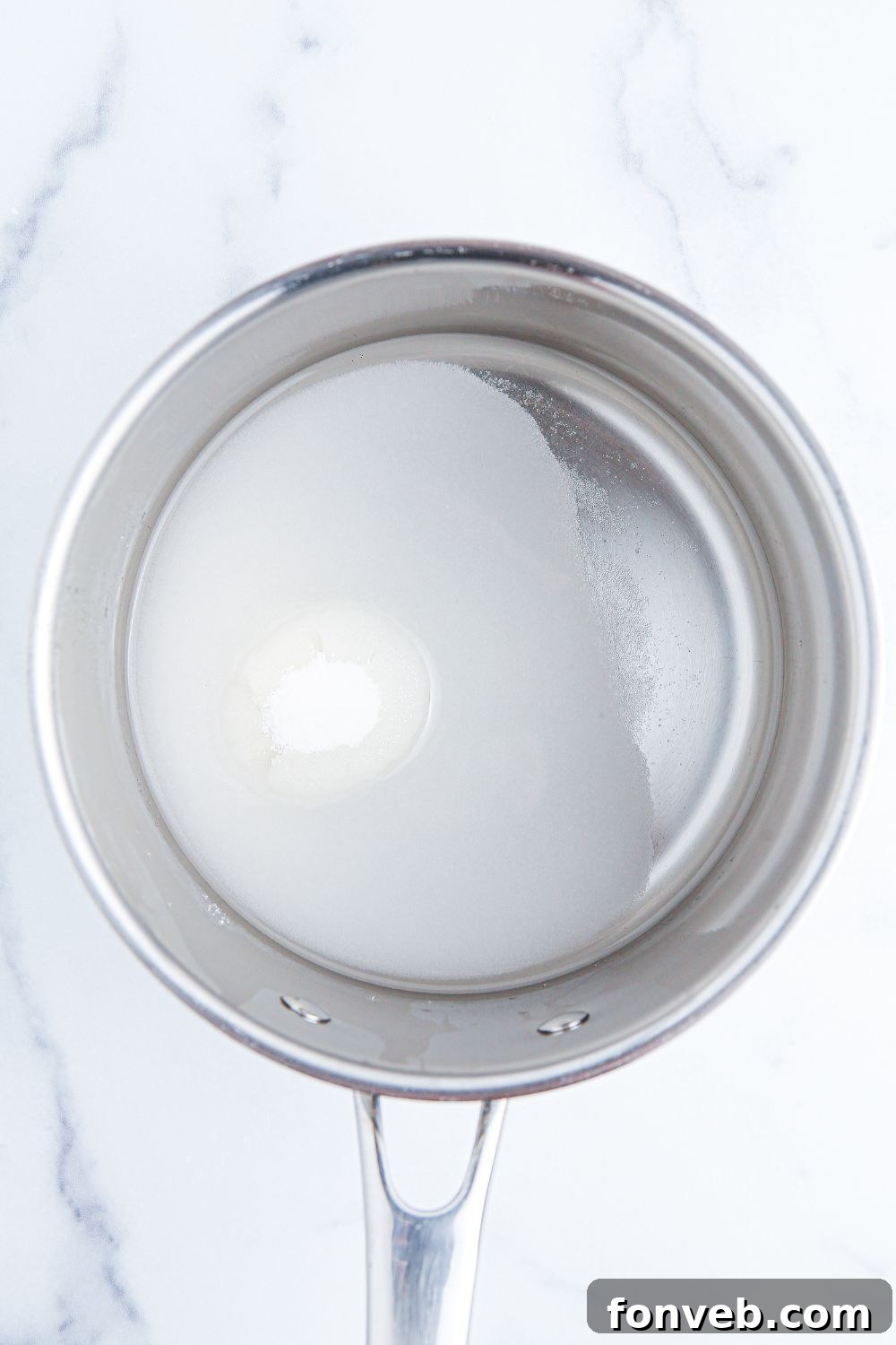 Sun-Kissed Peach Lemonade 6 sugar water in a small saucepan sitting on table