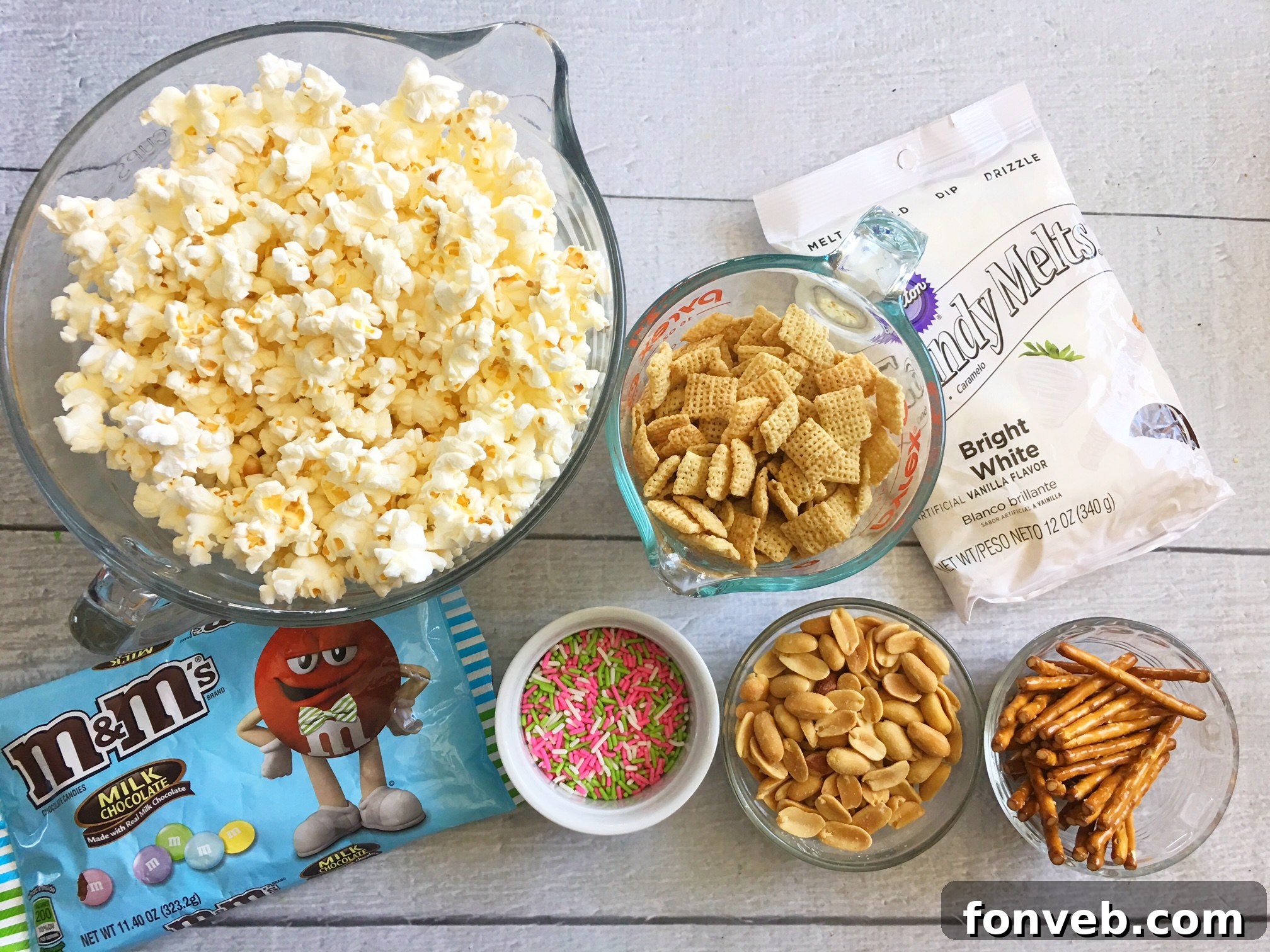 Bunny Bait Easter Crack spread out on a baking sheet, showing the base mixture before candy and sprinkles are added