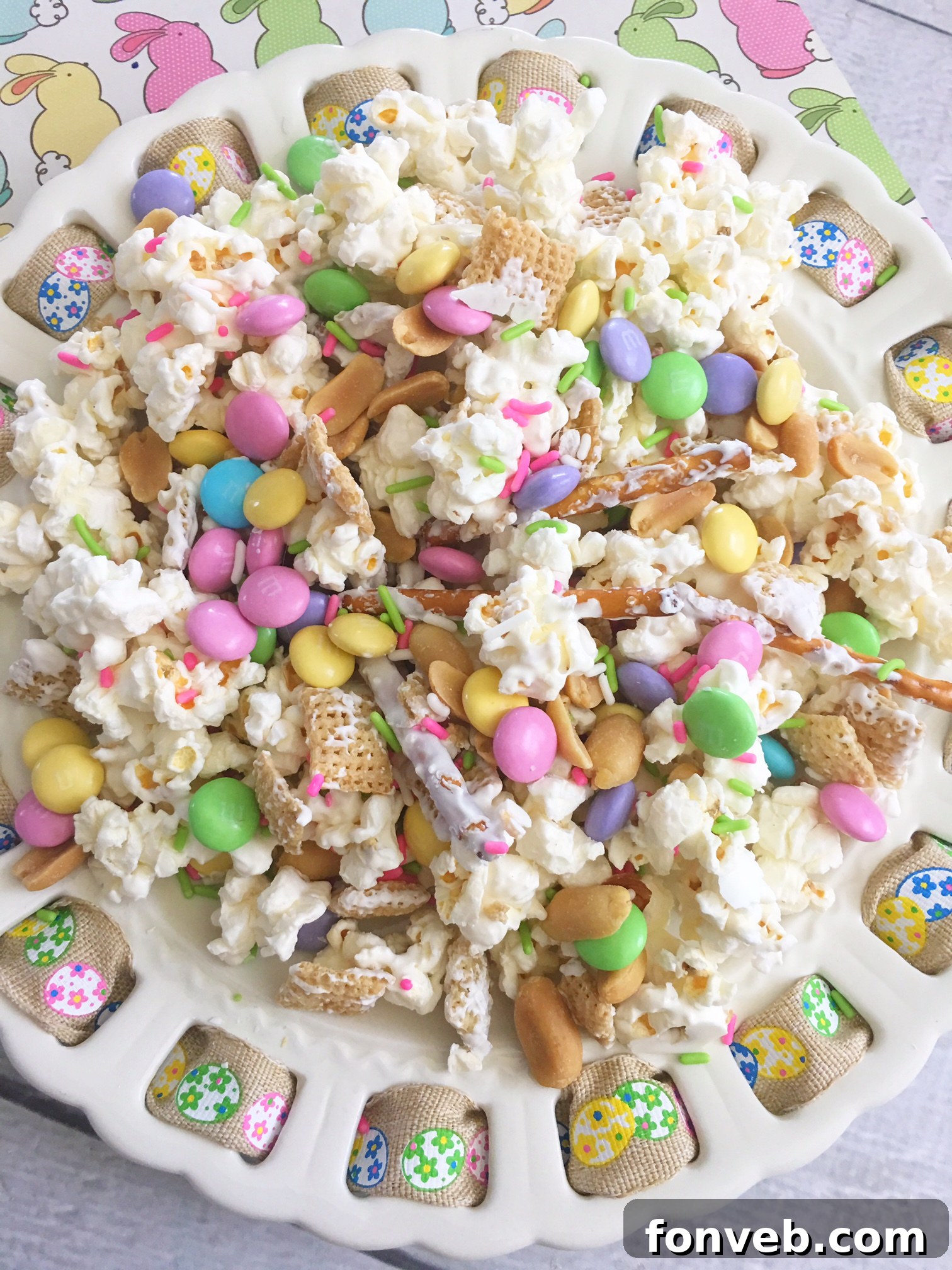 A generous serving of Bunny Bait Easter Crack in a clear bowl, highlighting its vibrant colors and textures