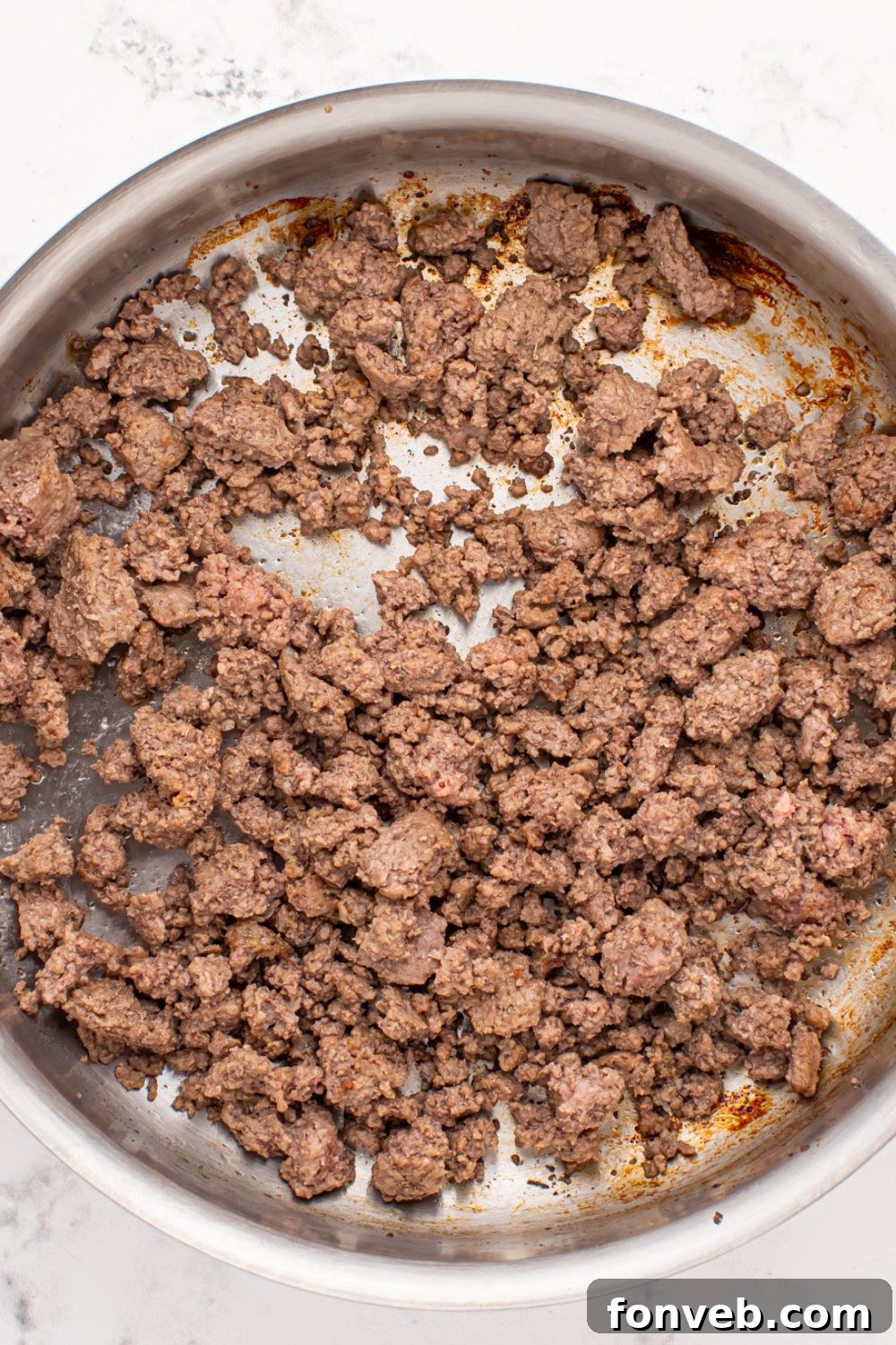 Creamy Philly Cheesesteak Pasta 5 cooked ground beef in a skillet