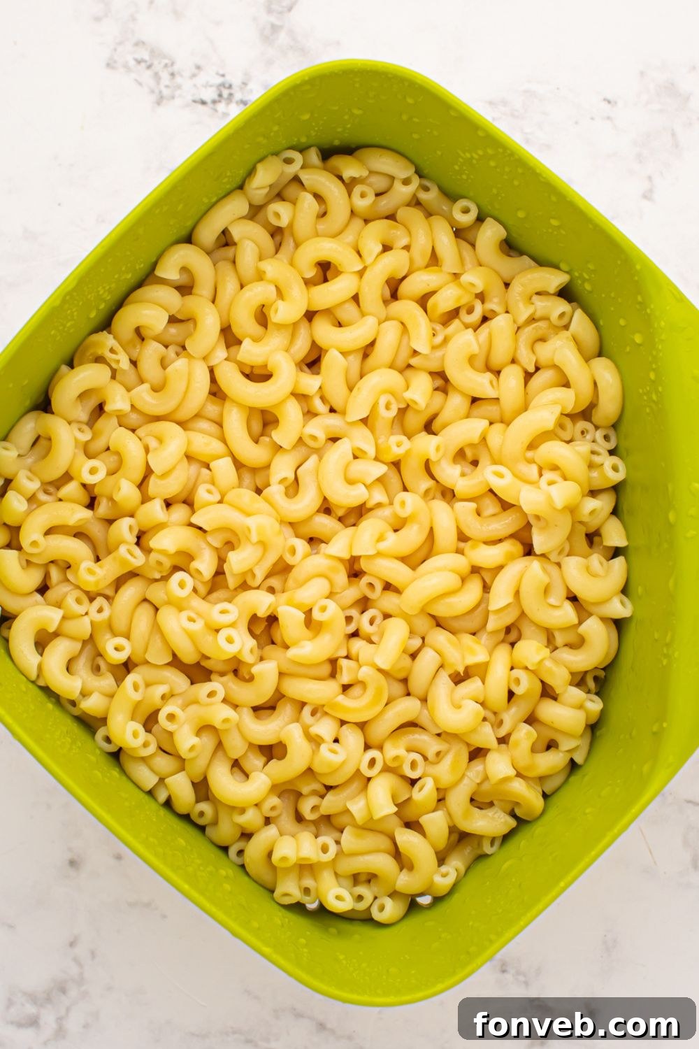 Creamy Philly Cheesesteak Pasta 7 cooked macaroni in a strainer