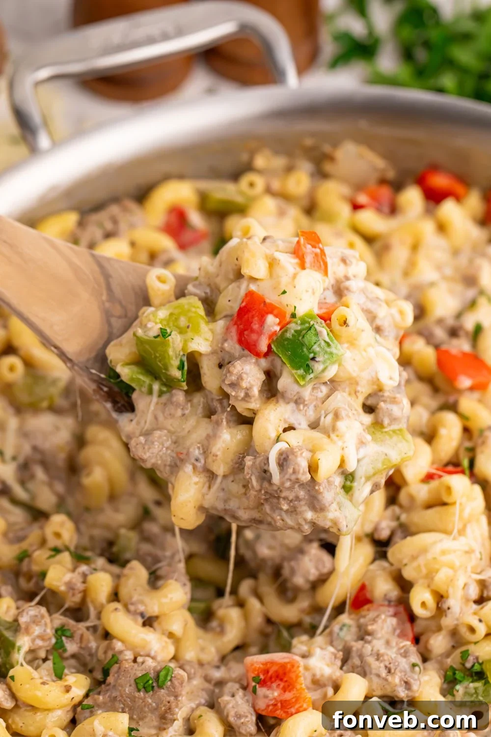 Creamy Philly Cheesesteak Pasta 10 Philly Cheesesteak Pasta in skillet with a spatula scooping some pasta up