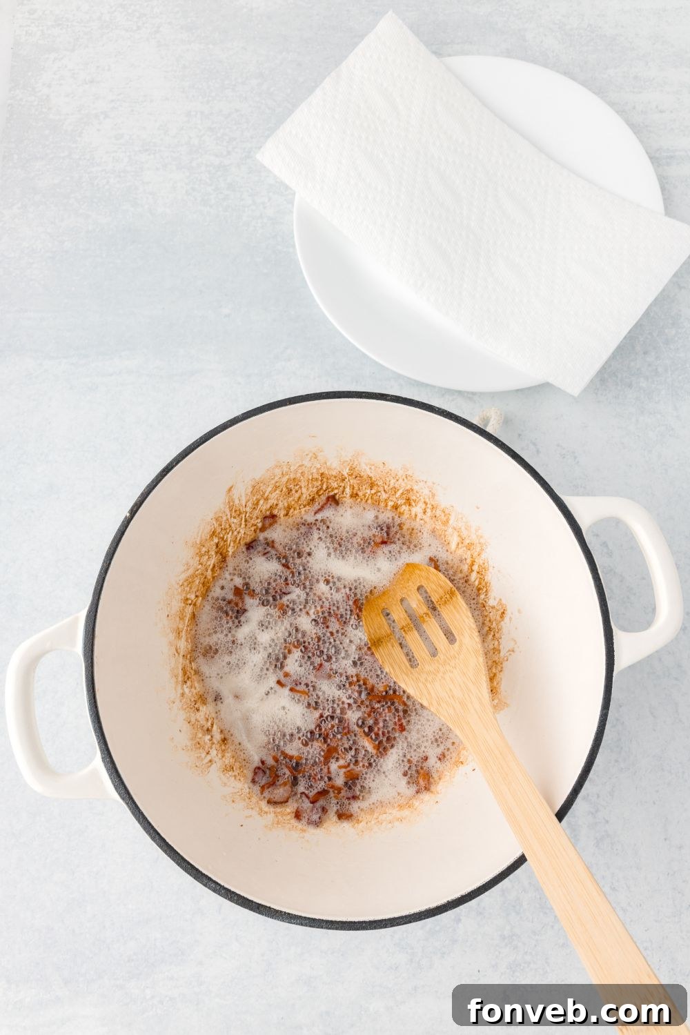 rendering fat off diced bacon in a stock pot for New England Clam Chowder