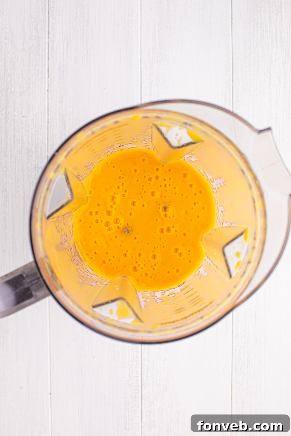 blender with a peach mixture blended up