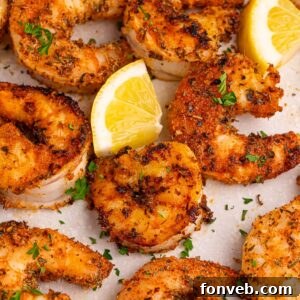 Cajun Grilled Shrimp on table with lemon slices on table
