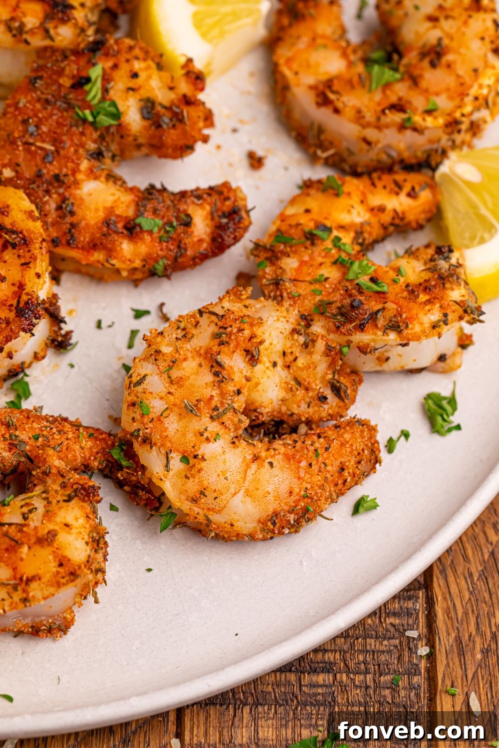 Cajun Grilled Shrimp on a plate with seasonings sprinkled on plate 