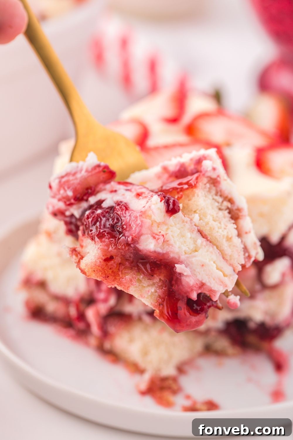 fork with a bite of Strawberry Tiramisu on it 