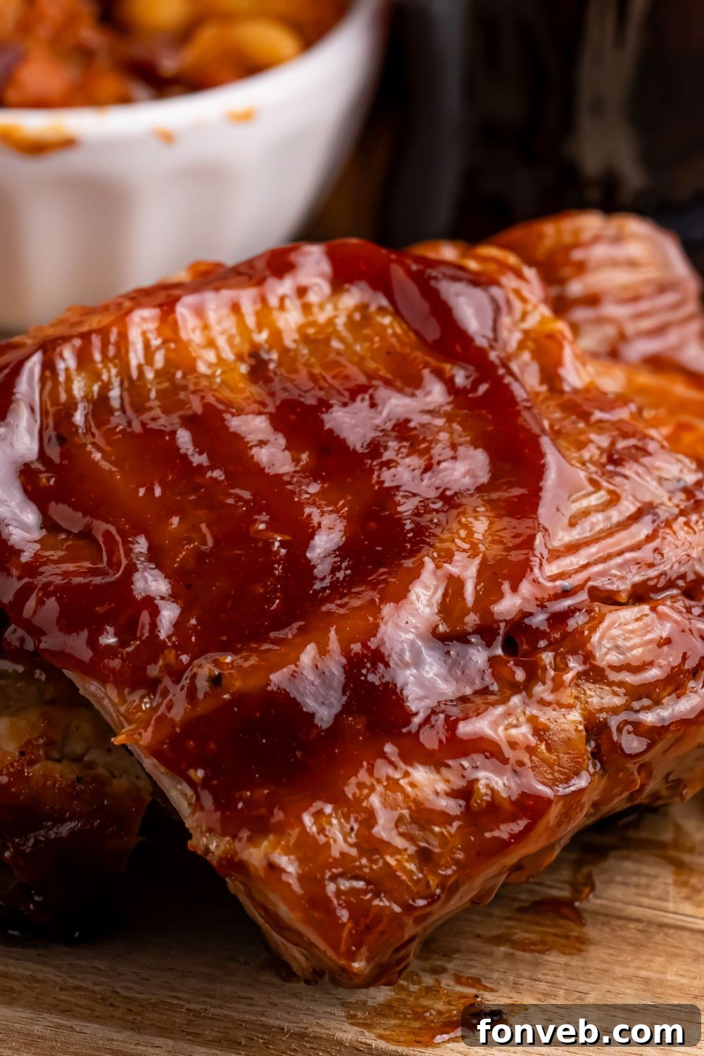 A close-up view showcasing the rich sauce and tender meat of Slow Cooker Coca Cola Ribs