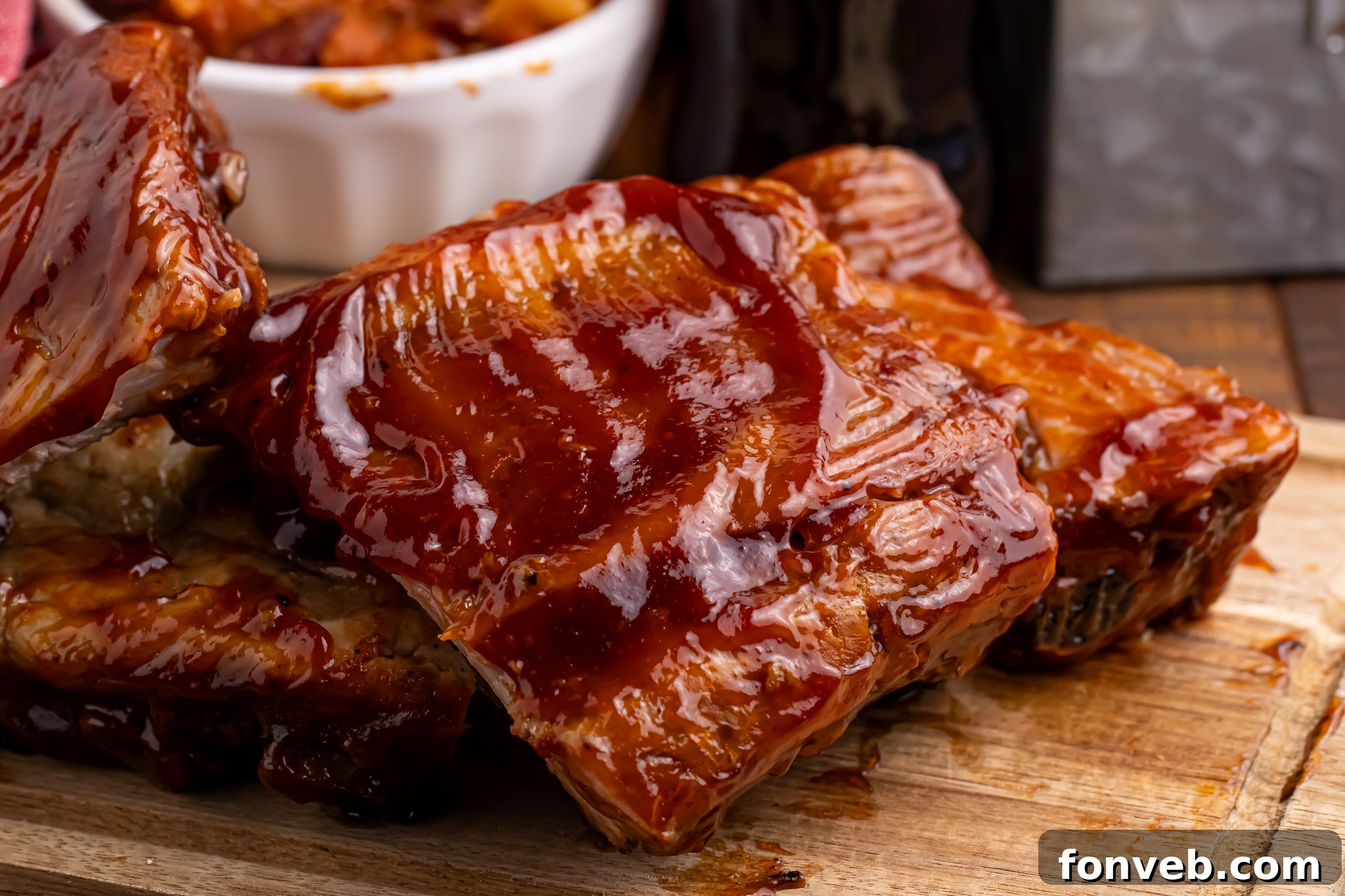 Fully cooked Slow Cooker Coca Cola Ribs arranged on a cutting board, ready to be served