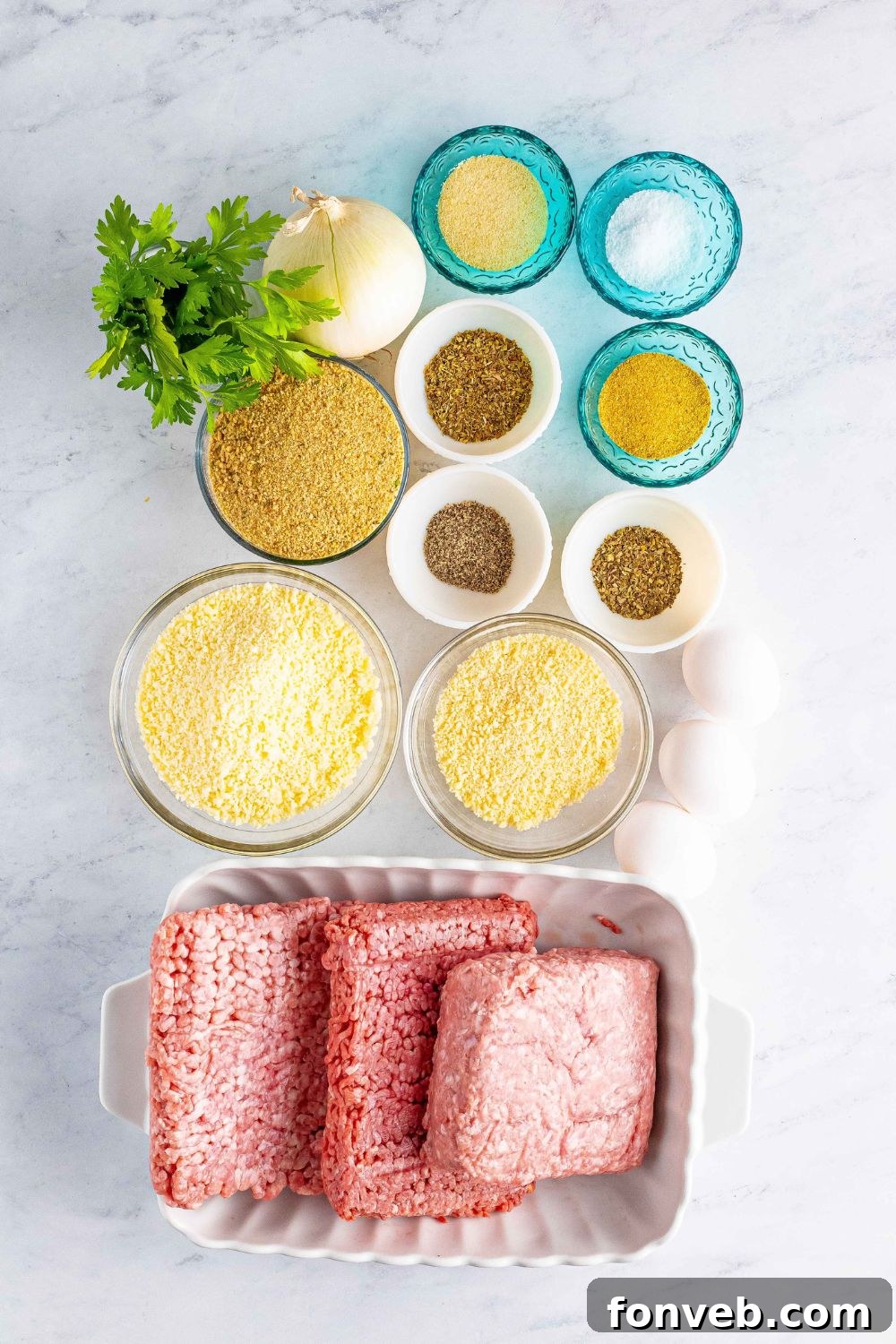 Classic Italian Meatball ingredients on a table with all the ingredients needed 