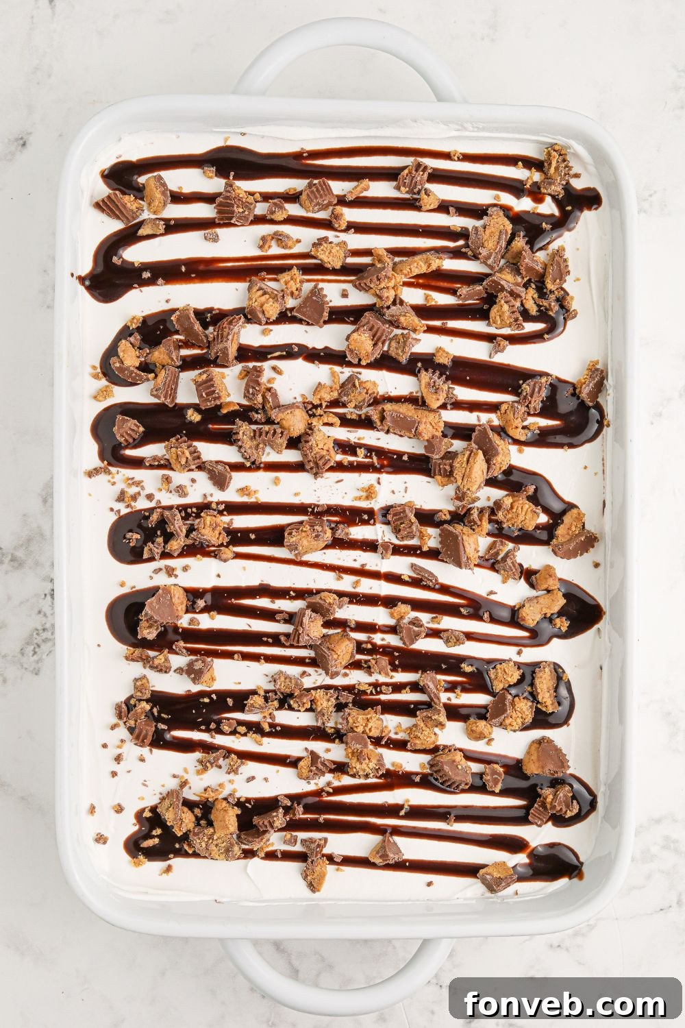 Peanut Butter Chocolate Sweet Stack 12 assembled Reeses Lasagna in a pan on table