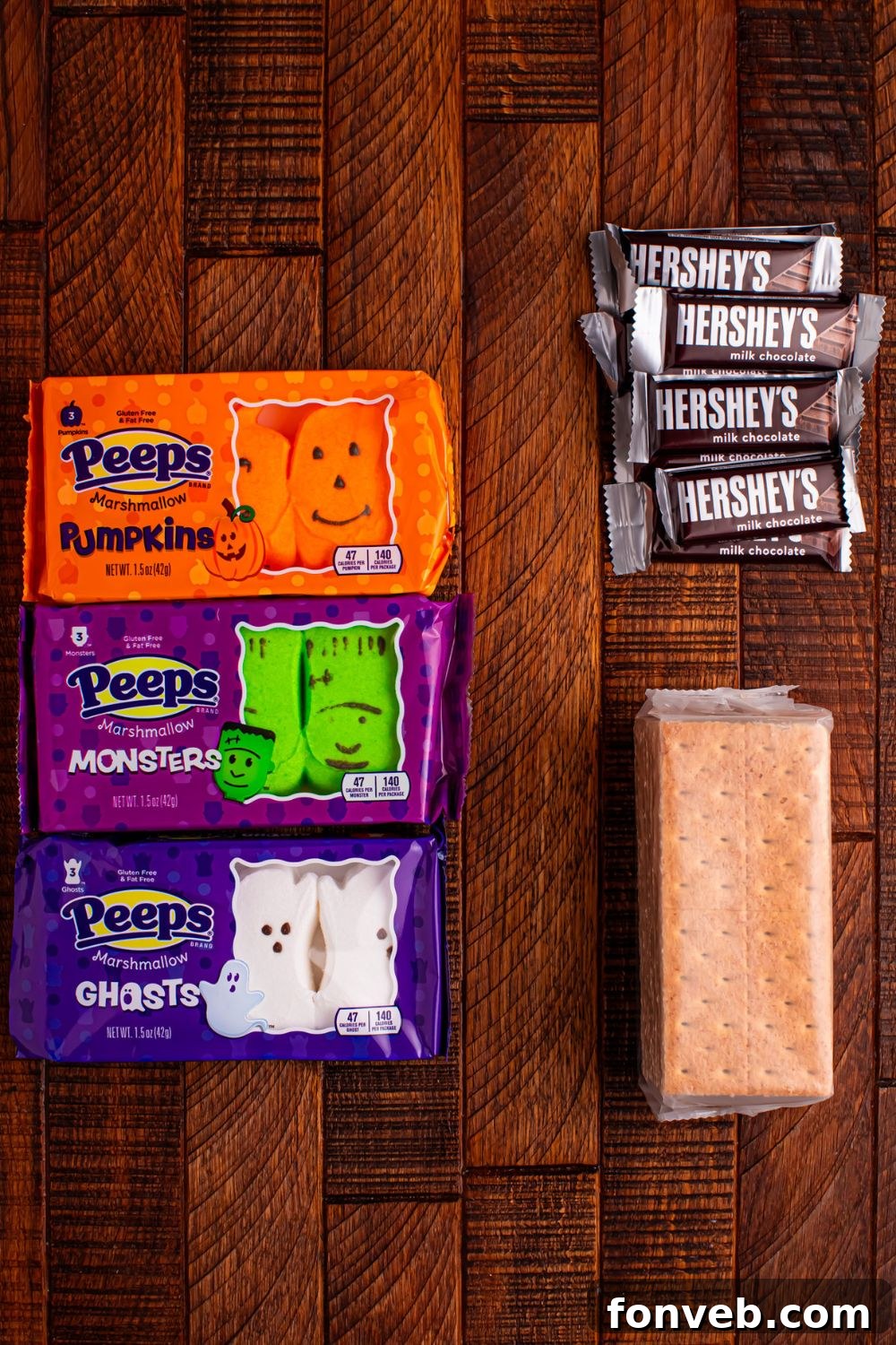 Spooky S'mores Kits 4 Halloween Smores Gift Bag ingredients on table: graham crackers, Hershey's, and Peep marshmallows