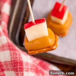 Caramel Apple Pretzel Bite on toothpick being held above pan on table