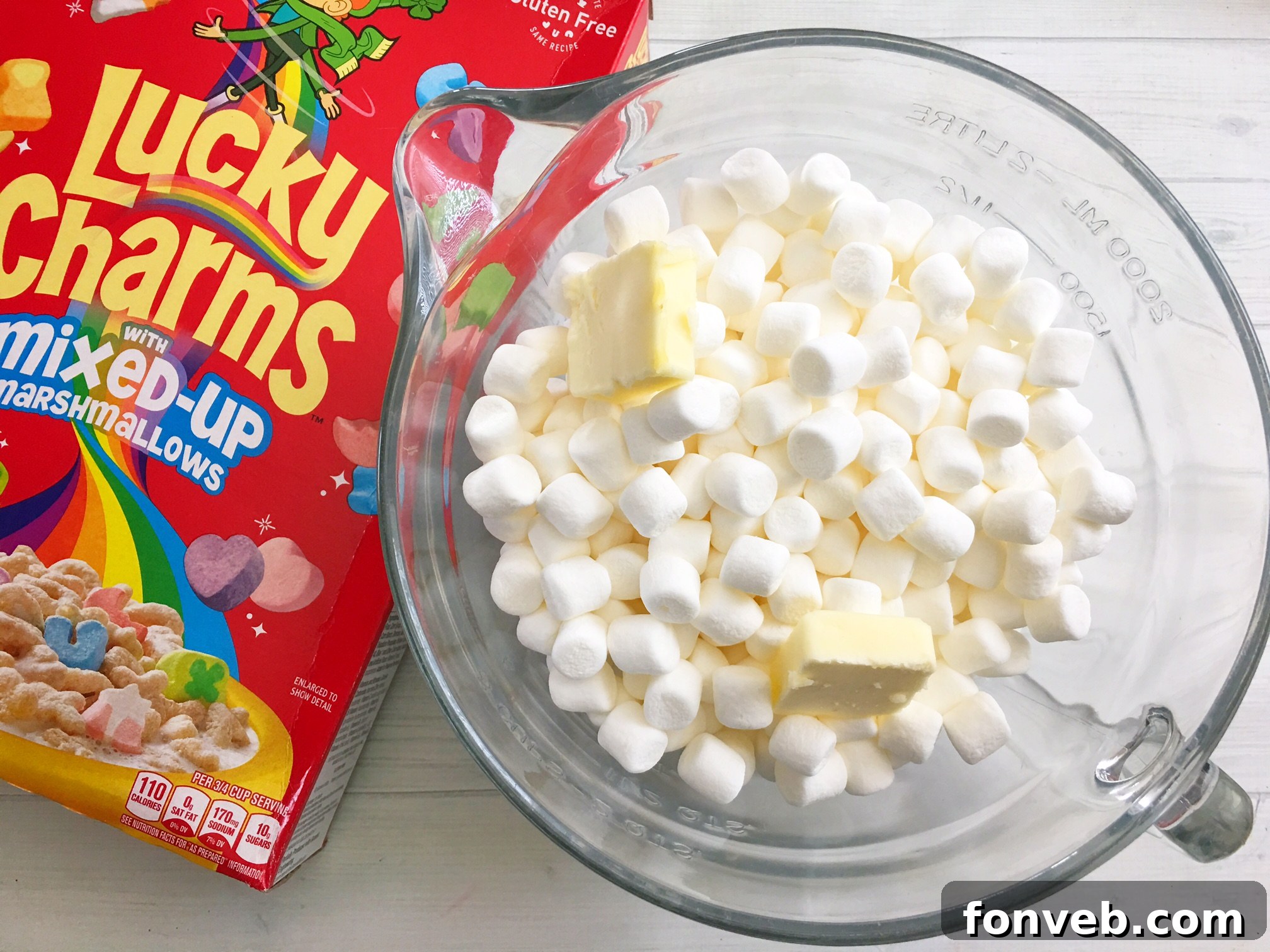 Close-up of a single Lucky Charms Krispy Treat square, showing the colorful marshmallow pieces embedded within.