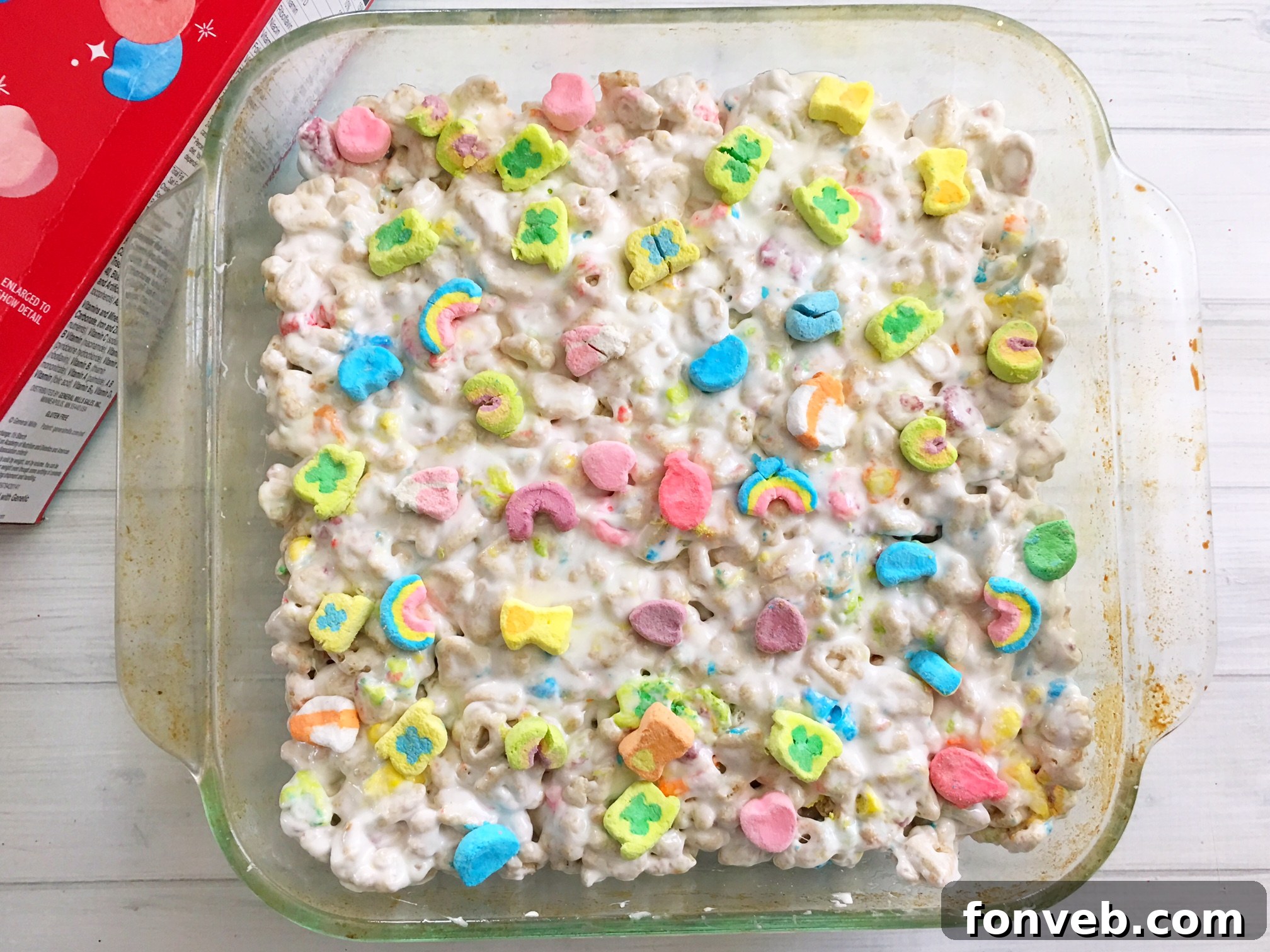 Several Lucky Charms Krispy Treats arranged on a platter, highlighting their uniform shape and colorful appeal.