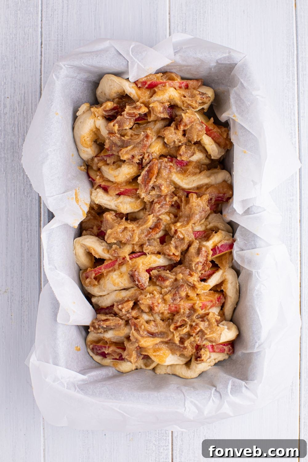 Apple Pie Monkey Bread 11 raw Apple Pie Pull Apart Bread in a loaf pan sitting on table