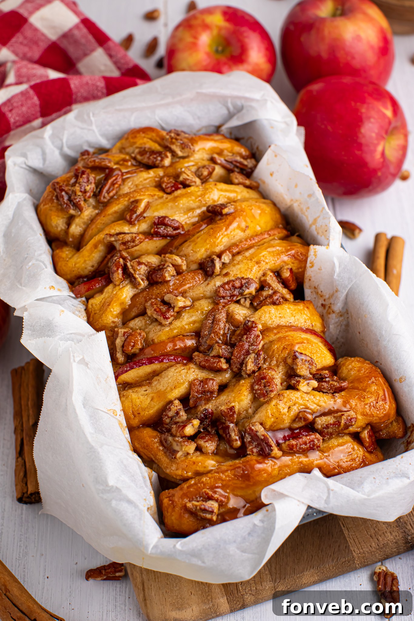 Apple Pie Monkey Bread 15 Apple Pie Pull Apart Bread in a pan topped with nuts and caramel sauce