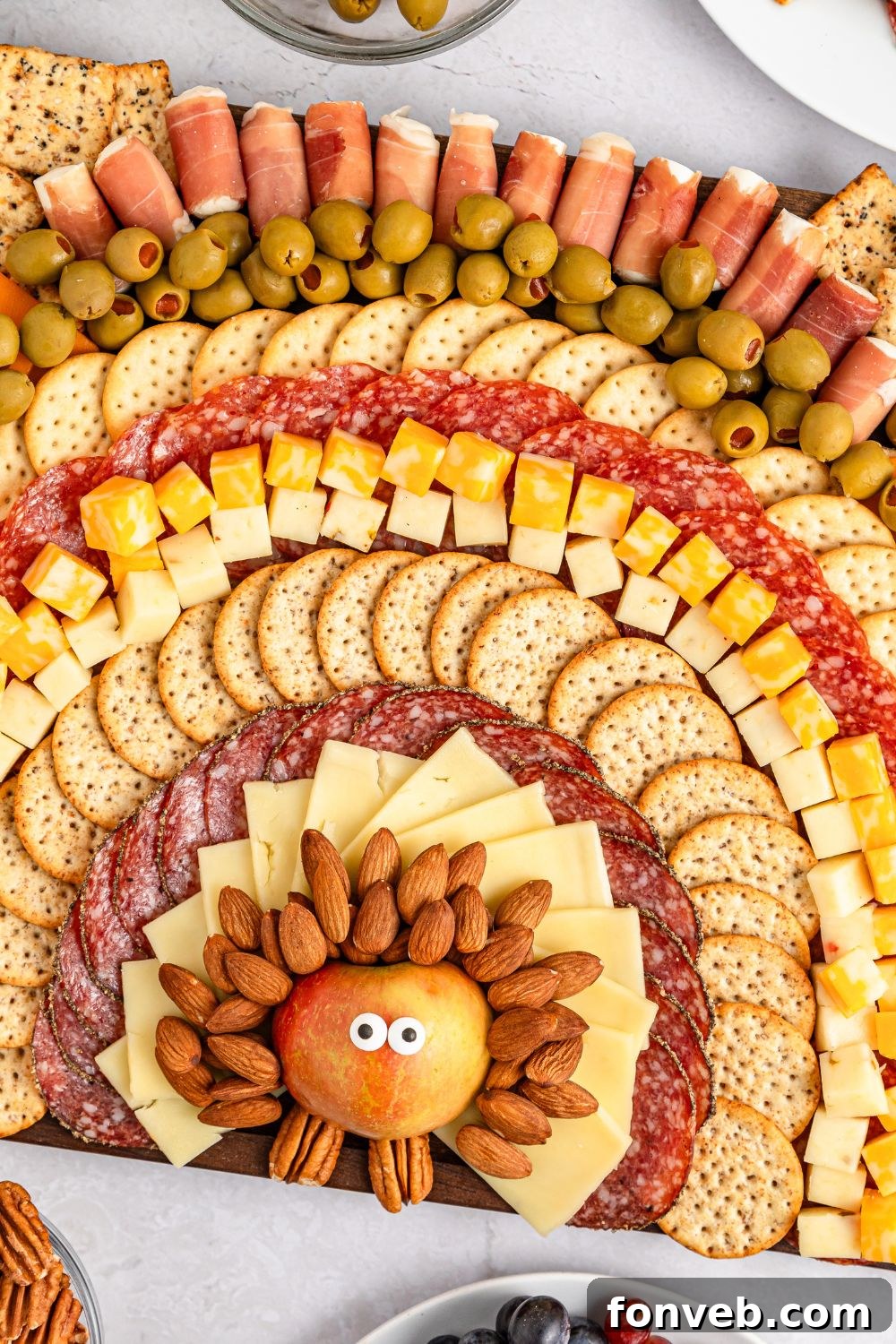 Turkish Bites Board 13 charcuterie board that looks like a turkey sitting on table at an angle