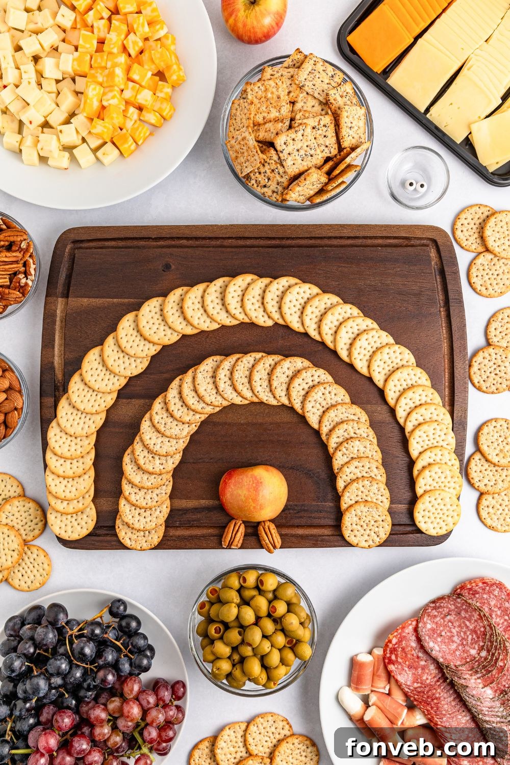 Turkish Bites Board 6 Turkey Snack Board being started with rows of crackers and apple