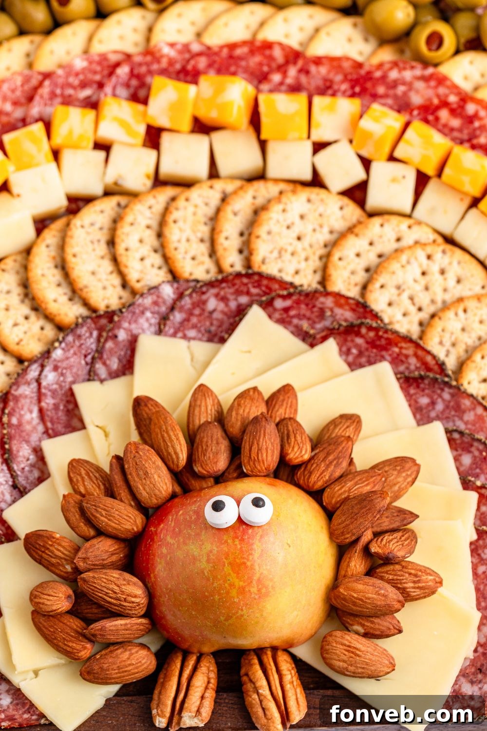 Turkish Bites Board 10 Turkey Snack Board on table with close up of apple with candy eyes on it