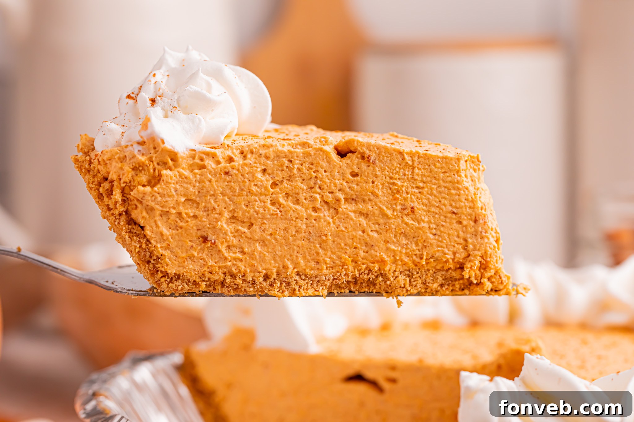 Marshmallow Pumpkin Pie slice being lifted up 