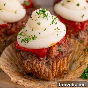 Meatloaf Cupcakes on table with the cupcake liner removed from the meatloaf