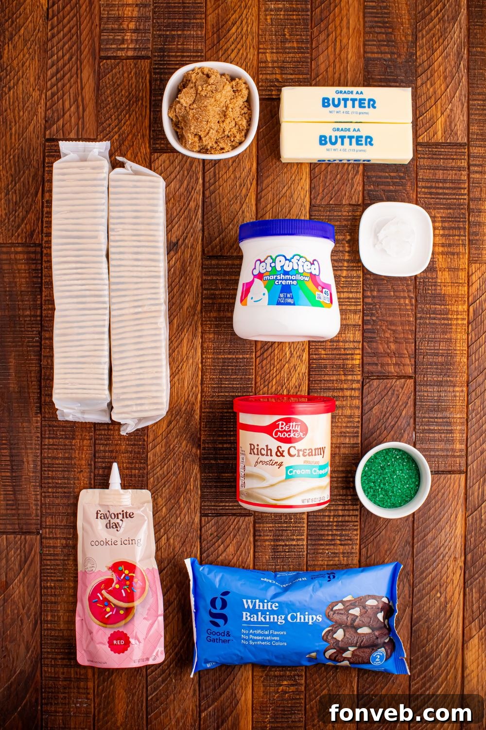 Addictive Little Debbie Christmas Tree Cake Toffee Bark 5 Christmas Tree Crack ingredients on wooden table in containers to show what all is needed