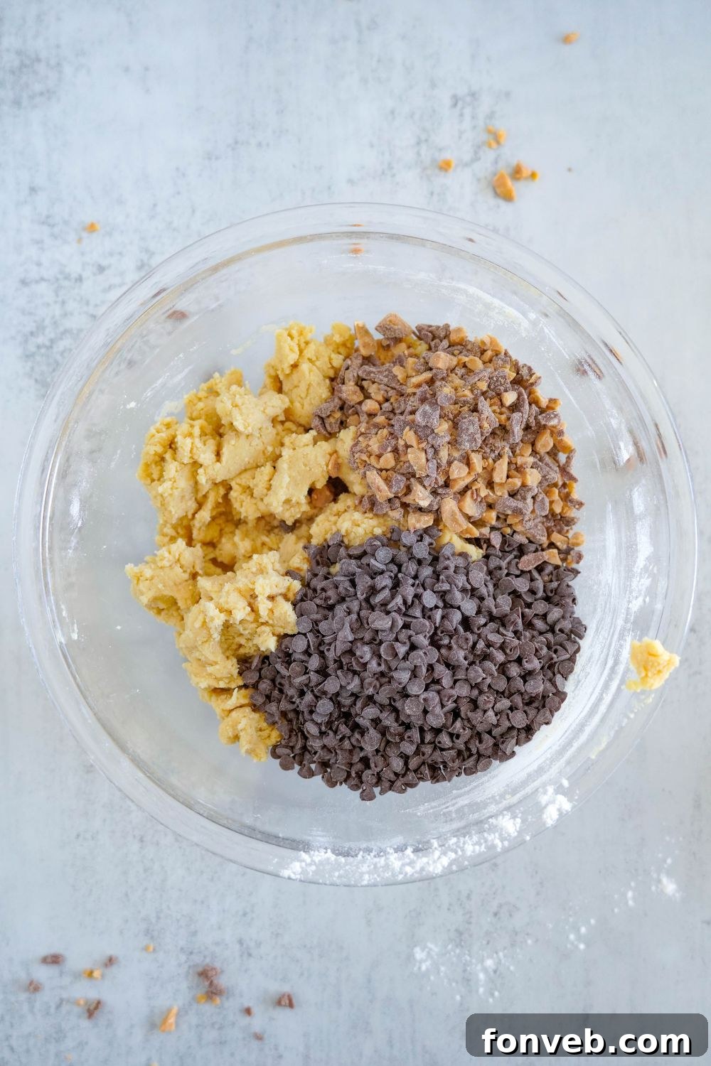 Chocolate Chip Toffee Cookie dough batter with toffee and chocolate chips on top 