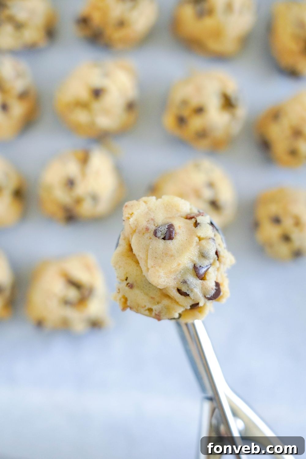 Chocolate Chip Toffee Cookie dough in a cookie scoop 