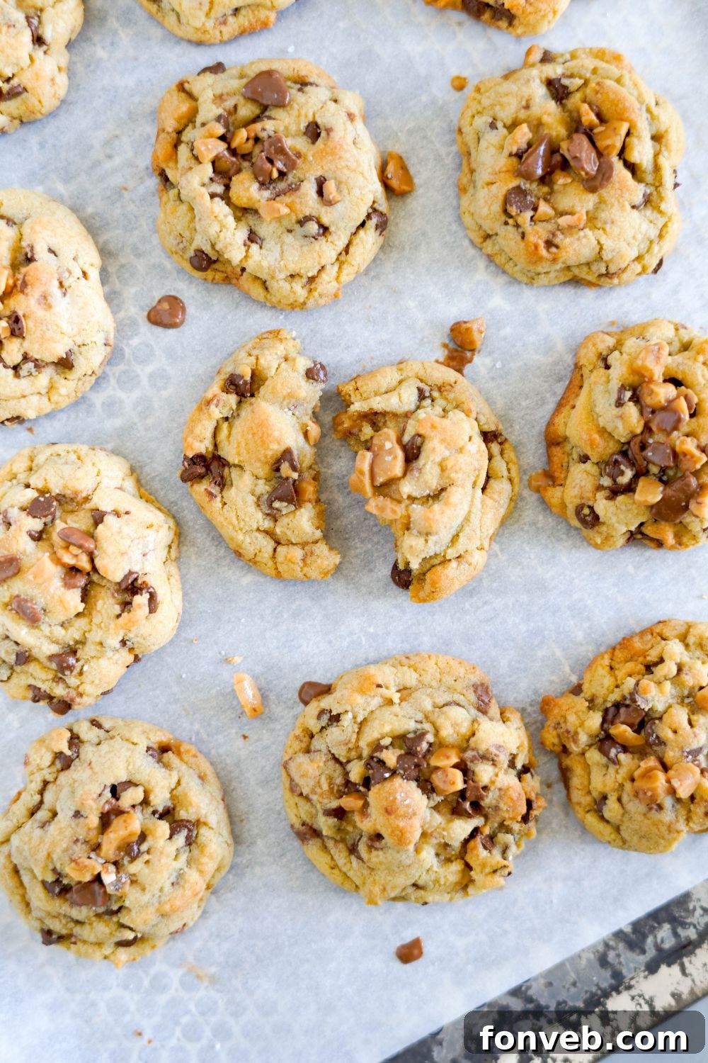 Chocolate Chip Toffee Cookies on baking tray with some broken 