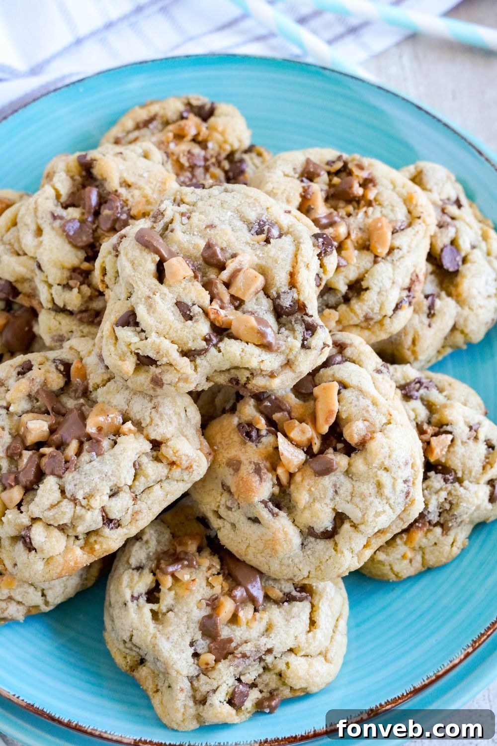 plate stacked with Chocolate Chip Toffee Cookies 