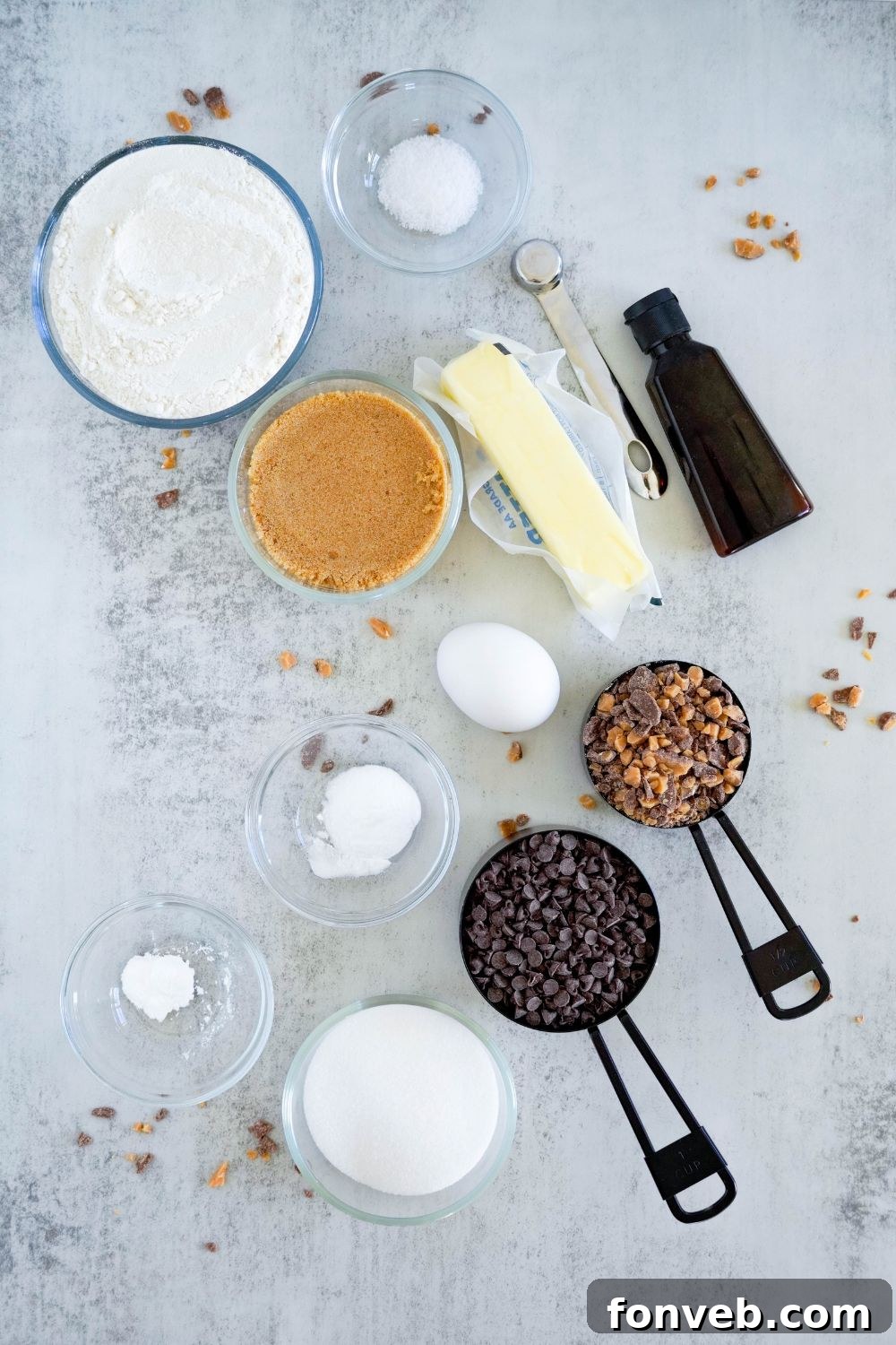 ingredients for Chocolate Chip Toffee Cookies on counter with ingredients in single serve containers 