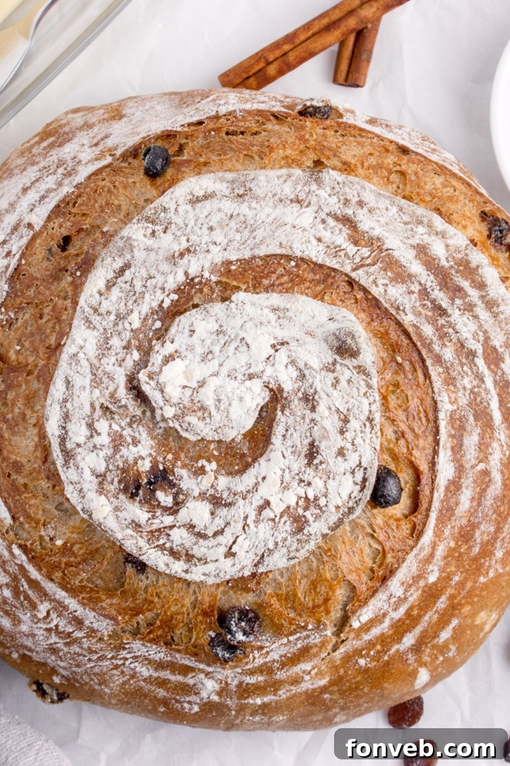 cinnamon raisin bread loaf on table with overhead shot of bread